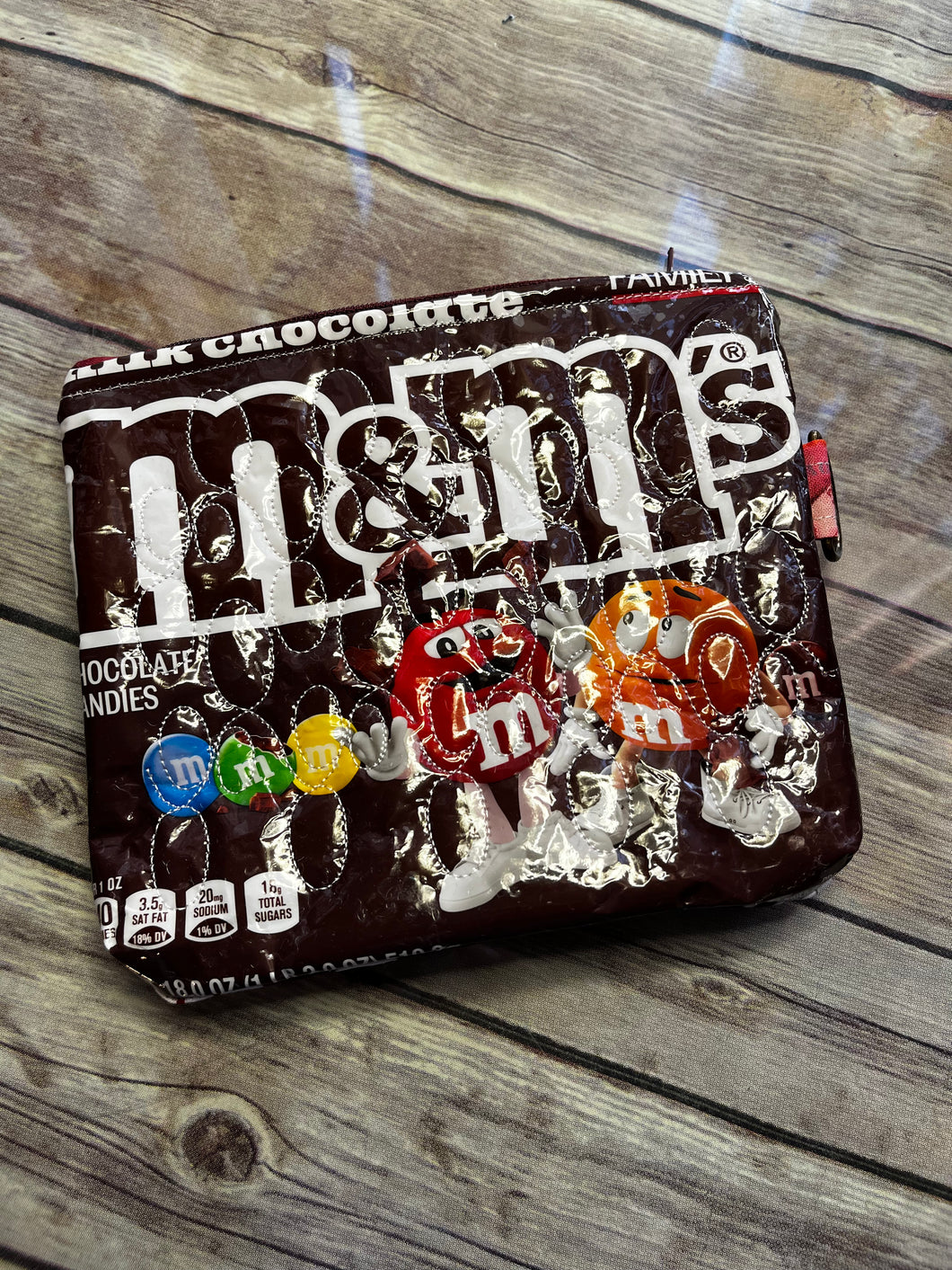 M & M milk chocolate embroidered clutch bag