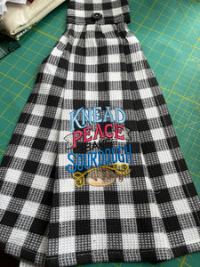 Over the door hanging towel.  Knead Peace, Bake Sourdough