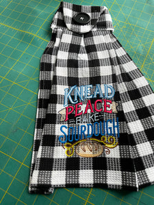 Over the door hanging towel.  Knead Peace, Bake Sourdough