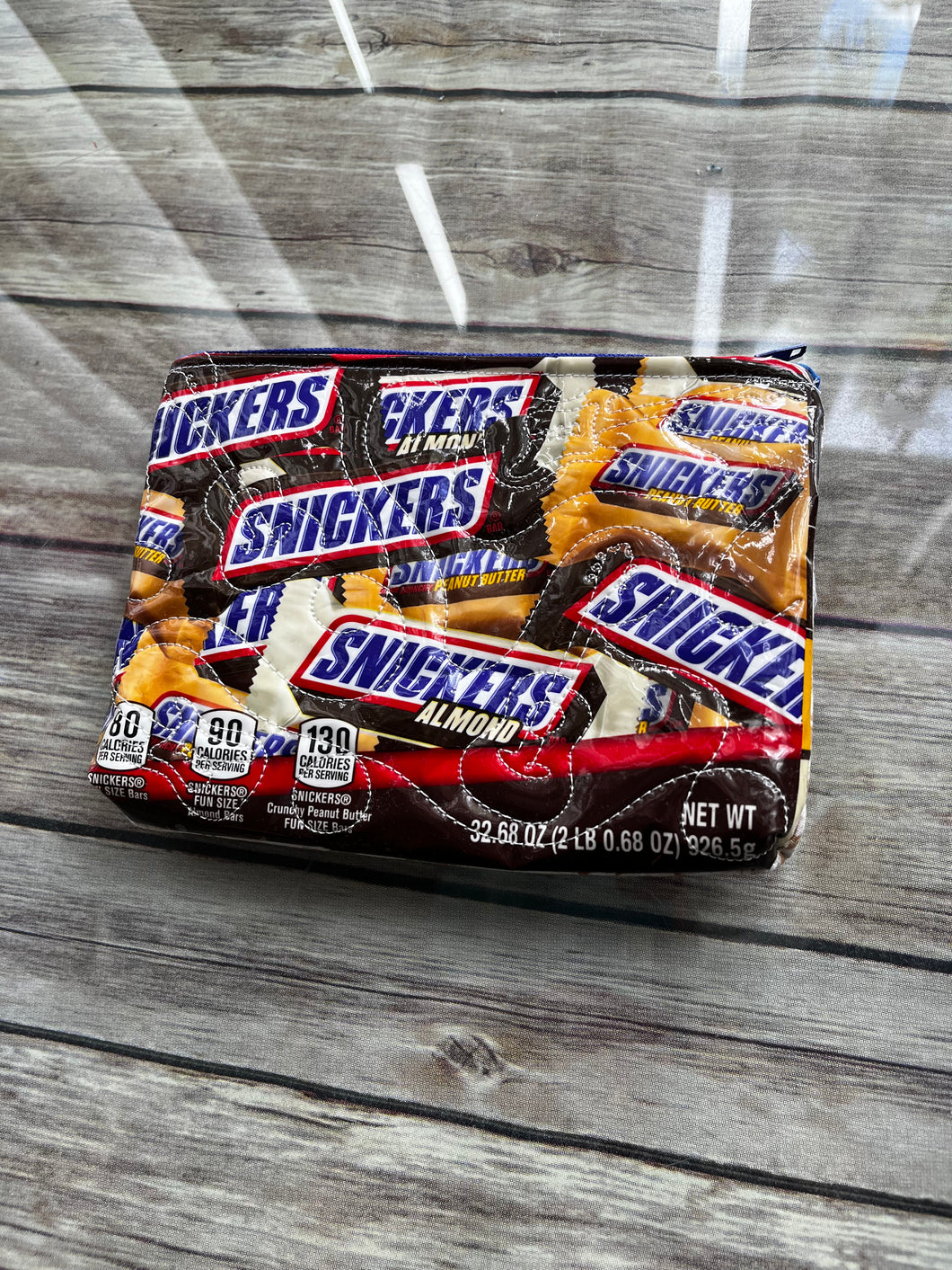 Snickers embroidered clutch bag