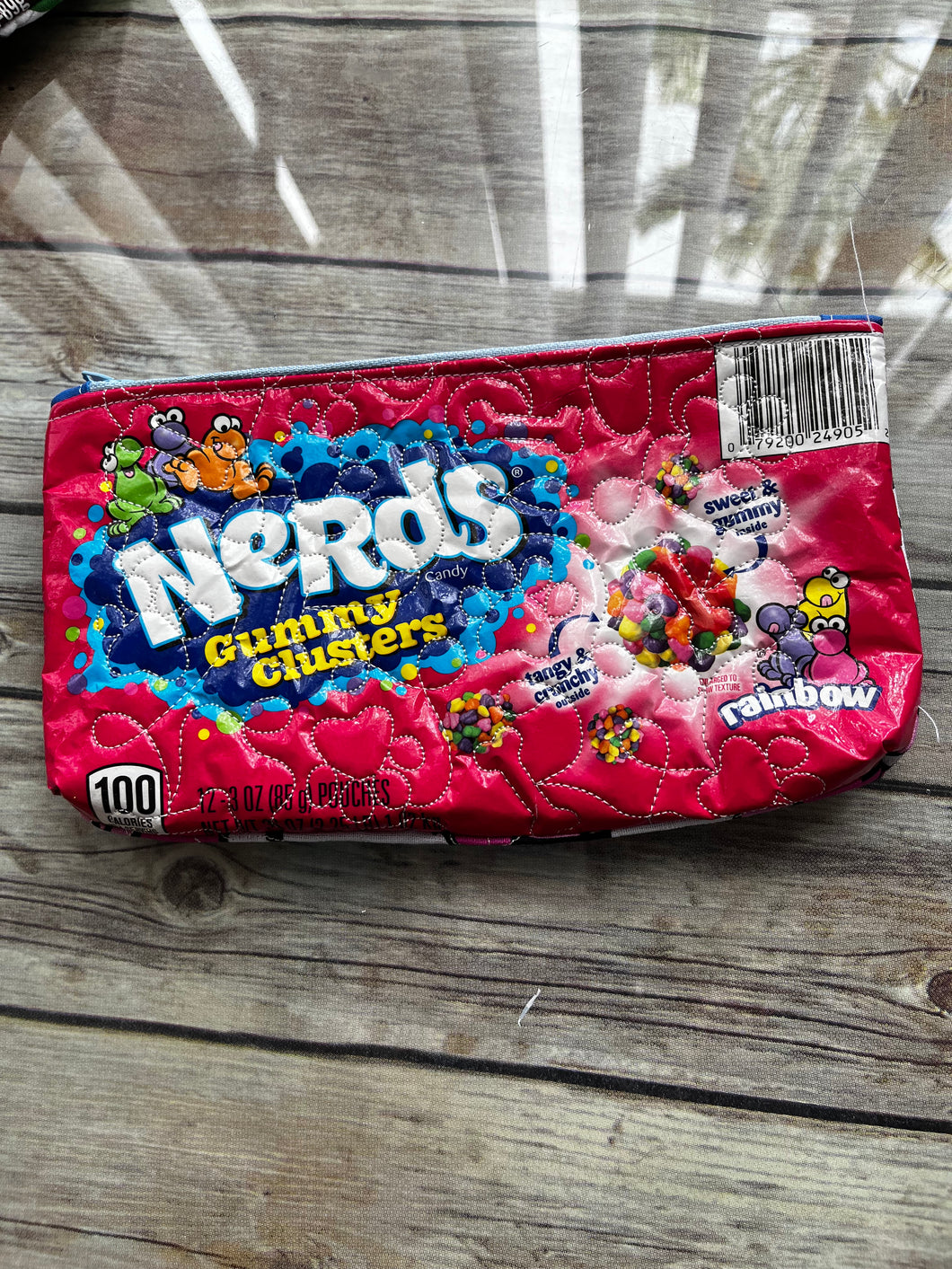 Nerds embroidered clutch bag
