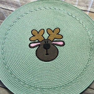 Round 15"placemat embroidered with Reindeer