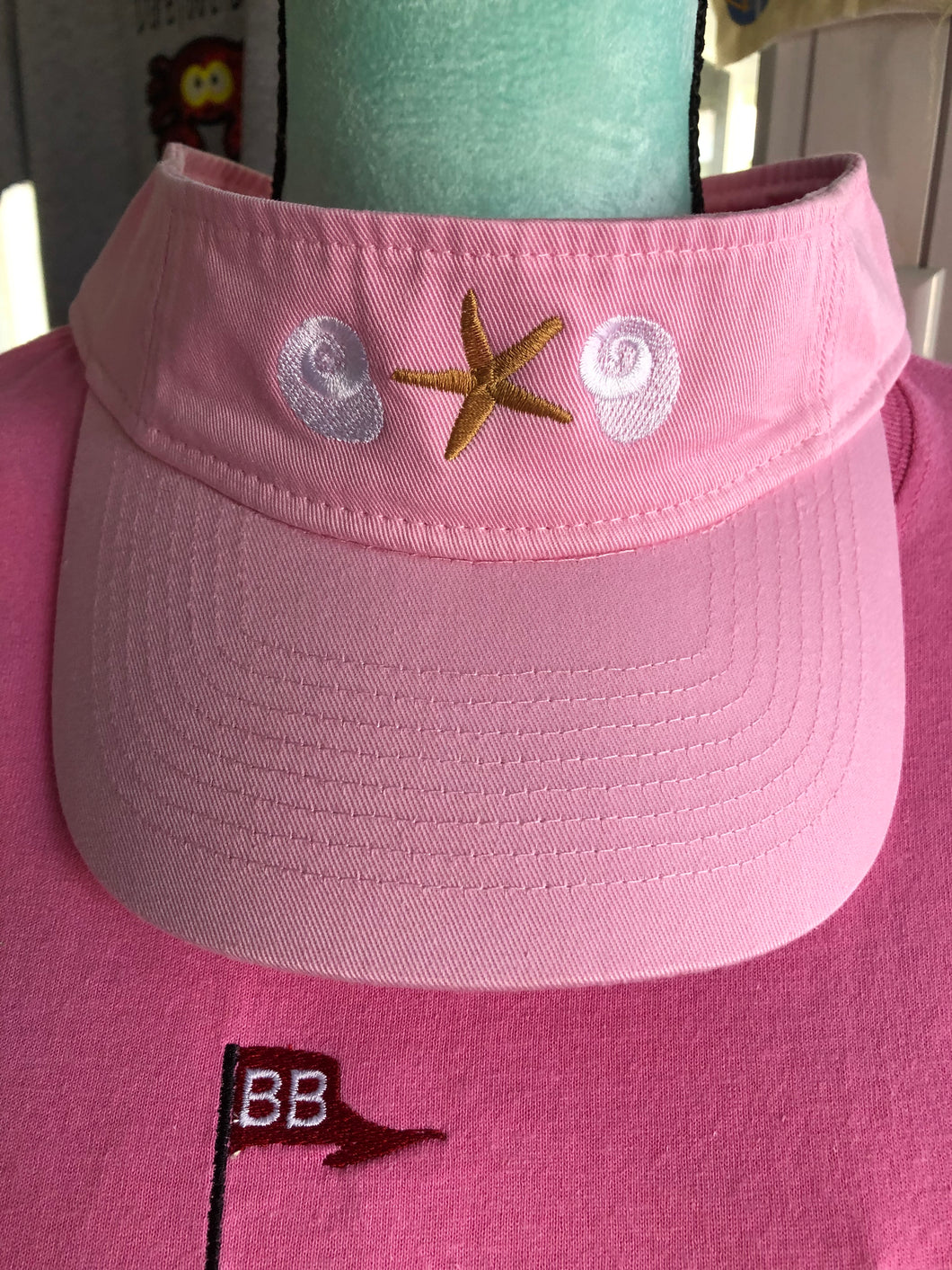 Pink visor with starfish and shells