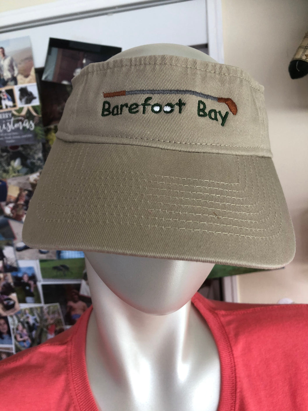 Tan visor with Golf balls and club Barefoot Bay