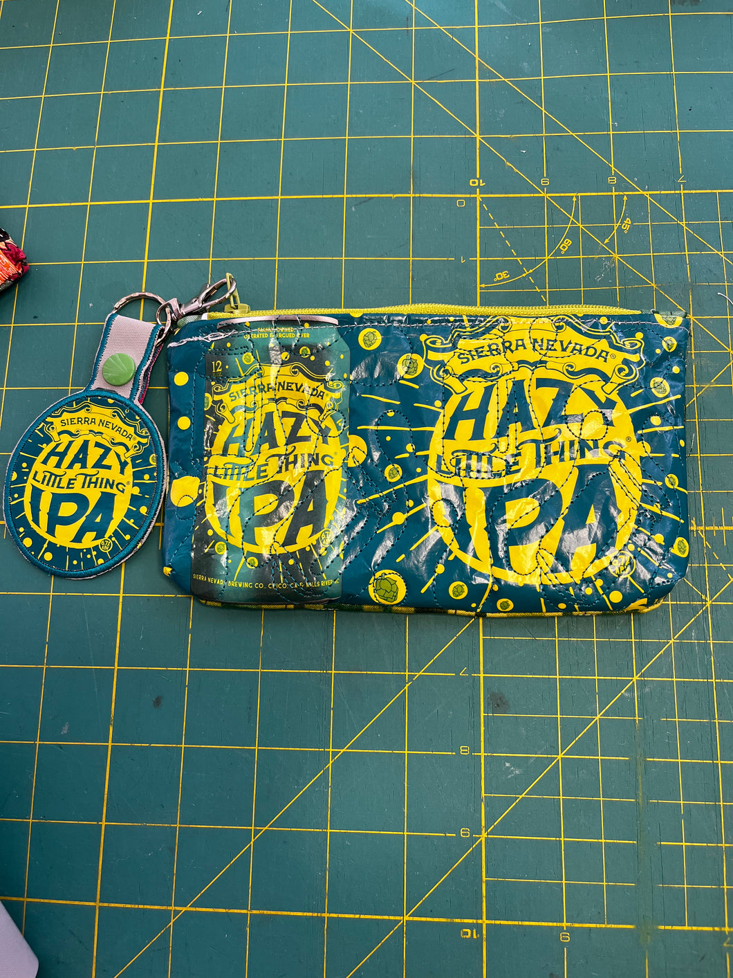 Hazy Little Things IPA zippered clutch bag with attached key tag